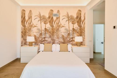 Ліжко або ліжка в номері Gran Villa Apart Malaga