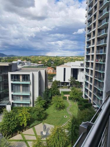 a view of a courtyard between two buildings at Luxury Menlyn Maine Apartment in Pretoria