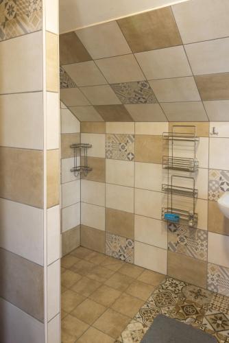 a bathroom with a shower and a sink at mlyn-osvracin in Osvračín