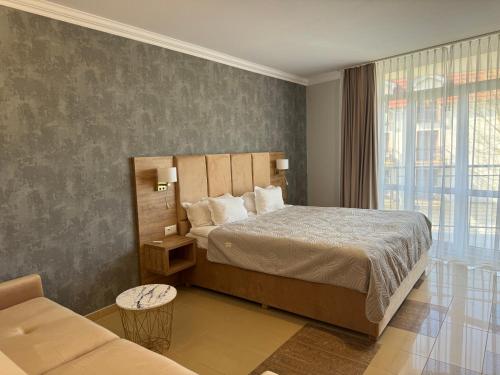 מיטה או מיטות בחדר ב-Avangard Resort