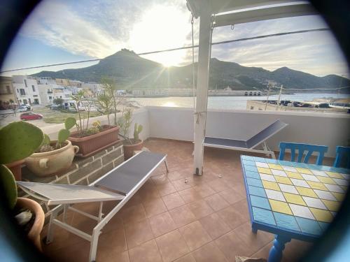 a view of a balcony with a table and chairs at Casa Emma in Favignana