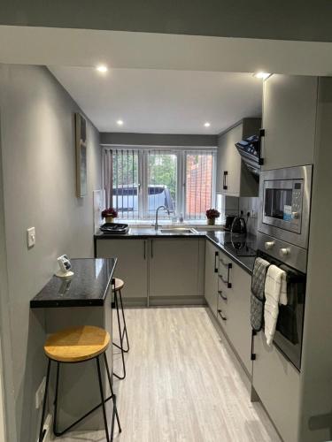 a kitchen with a sink and a counter top at Brook House Annex in Ipswich