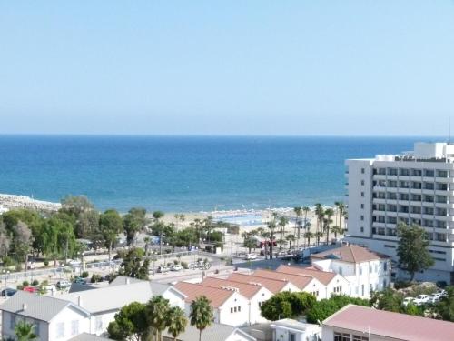 a view of the beach from a building at Aphrodite Heights in Larnaka