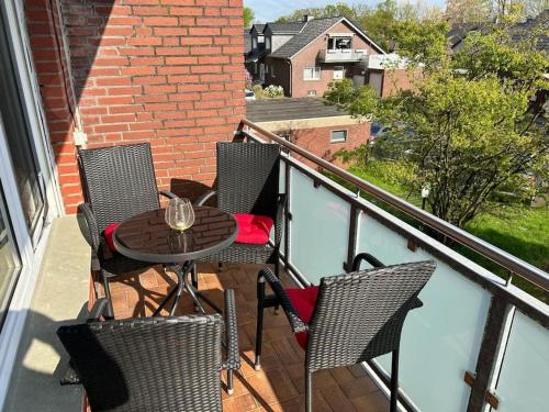 a patio with a table and chairs on a balcony at Fewo Stever-Aue in Lüdinghausen
