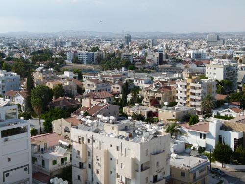 an aerial view of a city with buildings at Aphrodite Heights in Larnaka