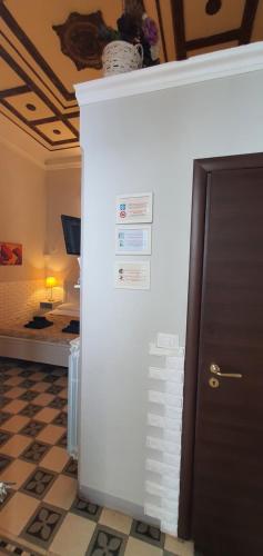 a white refrigerator in a room with a bed at Affittacamere Museo in Taranto