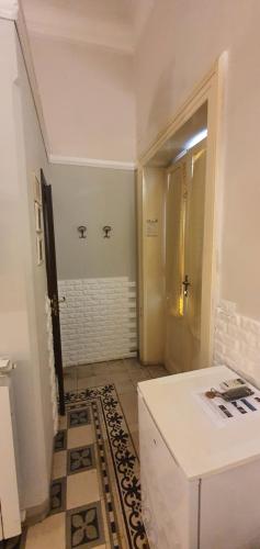 a bathroom with a sink and a shower in it at Affittacamere Museo in Taranto