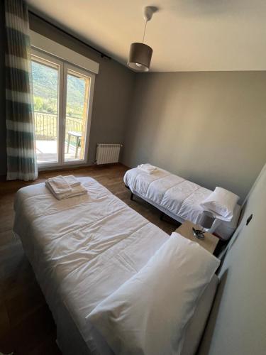 Postel nebo postele na pokoji v ubytování Casa Rural El Pinaron