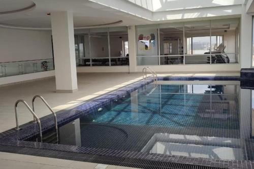 a large swimming pool in a building at BETH Accommodations Westlands Nairobi in Nairobi