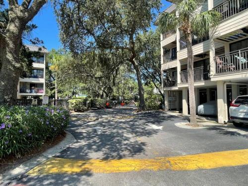a parking lot in front of a building at Beachy Keen Seaside Villa Near Coligny with Bikes! in Hilton Head Island