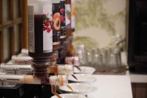 a table with plates of food on a machine at Hotel President in Montecatini Terme