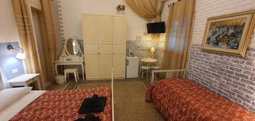 a small bedroom with a bed and a bathroom at Affittacamere Museo in Taranto