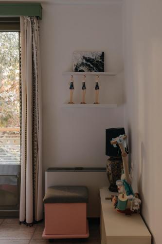 a room with shelves with figurines on the wall at Lazarus 2BD Apartment in the Center in Patra
