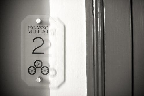 a refrigerator with the number on the door at Palazzo Villelmi in Cefalù