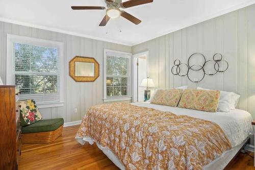 a bedroom with a bed and a ceiling fan at Cypress Grove - Dog River in Mobile