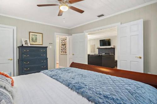 a bedroom with a bed and a ceiling fan at Cypress Grove - Dog River in Mobile