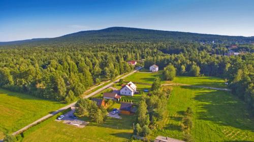 an aerial view of a house in the middle of a field at Domek Bursztyn in Święta Katarzyna