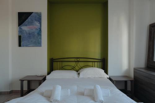 Posteľ alebo postele v izbe v ubytovaní Nefeli City Apartments