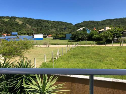 a view of a park from a balcony at Reserva Praia Hotel in Balneário Camboriú