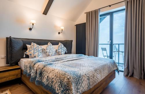 Postel nebo postele na pokoji v ubytování New Gudauri Apartments