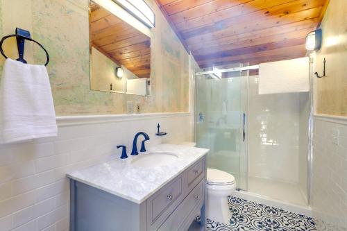 a bathroom with a sink and a shower and a toilet at Spacious Pinedale Home with Mountain Range View in Pinedale