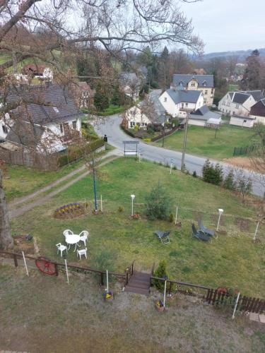 a park with a statue of a horse in the grass at Gasthof Oberschmiede in Auf der Wiese