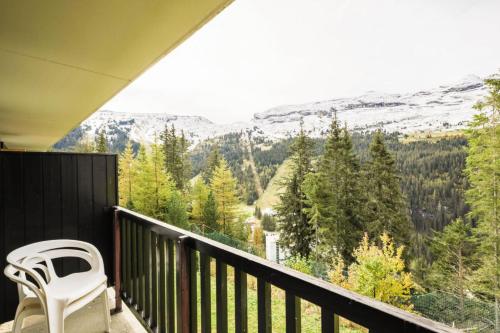 a balcony with a chair and a view of the mountains at Résidence Sirius - maeva Home - Studio 4 Personnes - Confort MAE-3896 in Arâches-la-Frasse