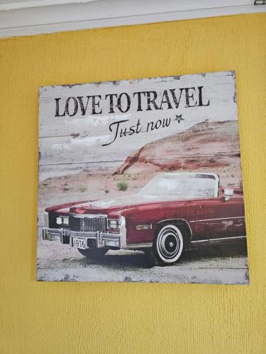 a painting of a red car on a wall at Hostal Pucara Molina in Molina