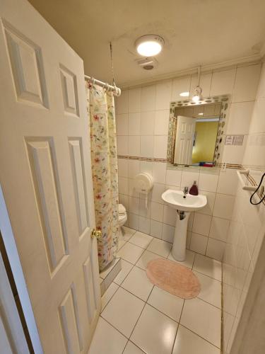 a bathroom with a sink and a toilet at Hostal Pucara Molina in Molina