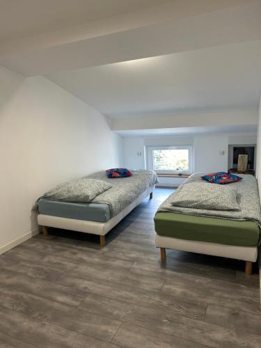 Postel nebo postele na pokoji v ubytování Appart Pro & Famille