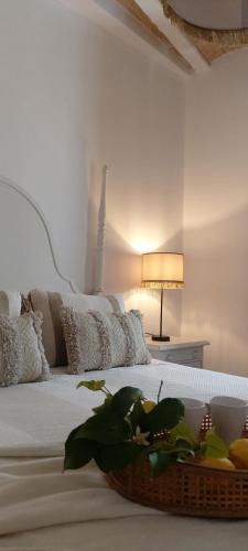 a bedroom with a bed with a basket on it at Casa Rural Candelas in Zahara de la Sierra