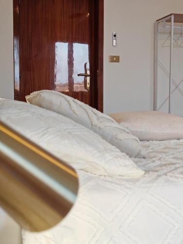 a close up of a bed in a room at Verdeacquassisi in Rivotorto 