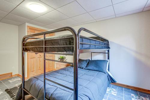 a bedroom with a bunk bed in a room at Family Home with Indoor Pool about 2 Mi to Elkhart Lake! in Elkhart Lake