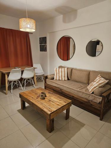 a living room with a couch and a table at Palermo Apart 3 in Buenos Aires