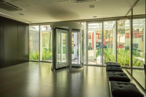 a room with a couch in the middle of a building at BHomy Turiassu in Sao Paulo