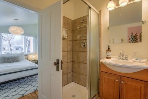 a bathroom with a sink and a shower at Vintage Tiny House CUTE 1BDRM Big Appeal in Colorado Springs