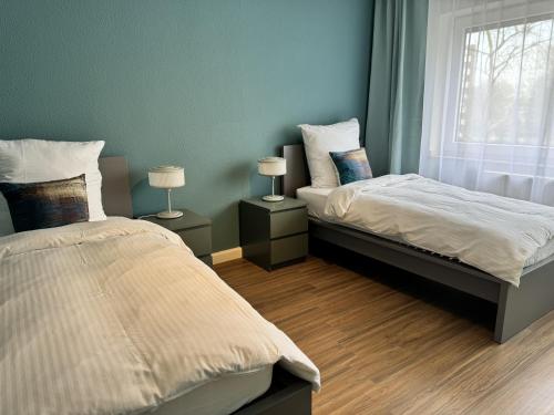 Postel nebo postele na pokoji v ubytování JUNX Bude
