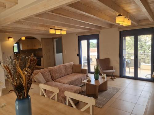 a living room with a couch and a table at Maria’s family house’s in Elafonisos