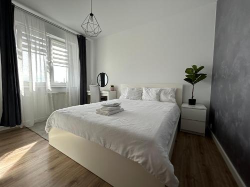 Posteľ alebo postele v izbe v ubytovaní 5th Floor Apartment