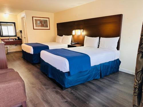 Postel nebo postele na pokoji v ubytování Northwoods Motel