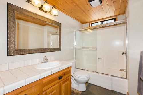 a bathroom with a sink and a toilet and a shower at Mineral Springs 3 BR w Hot tub Available in Alpine Meadows in Olympic Valley