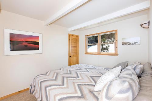 a white bedroom with a bed and a couch at Mineral Springs 3 BR w Hot tub Available in Alpine Meadows in Olympic Valley