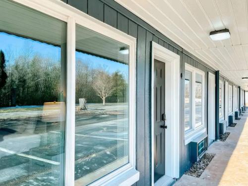 an exterior view of a house with sliding glass doors at Meadow Room At The Trailblazer Unit 7 in Townsend
