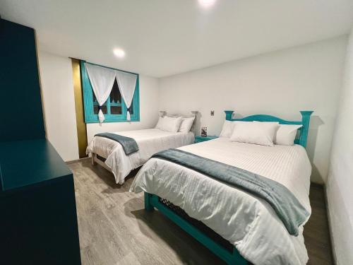 Ένα ή περισσότερα κρεβάτια σε δωμάτιο στο Hotel Club el Llano - Combita
