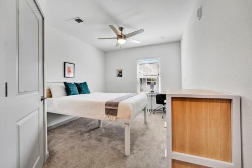 a bedroom with a bed and a ceiling fan at 1 mi to DT on Lake Hartwell parking pool gym in Clemson