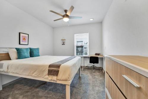 a bedroom with a bed and a ceiling fan at Near CU and minutes to DT gym pool hammock in Clemson