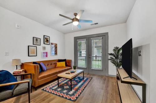 a living room with a couch and a ceiling fan at Dockside Lake Hartwell 2BR with Unique Amenities in Clemson