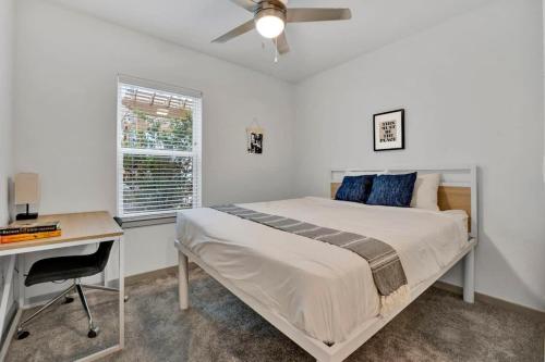 a bedroom with a bed and a desk and a window at Dockside Lake Hartwell 2BR with Unique Amenities in Clemson