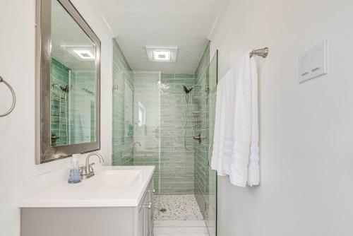 a bathroom with a sink and a shower at Charming Riverfront Home with Kayaks! in Crystal River