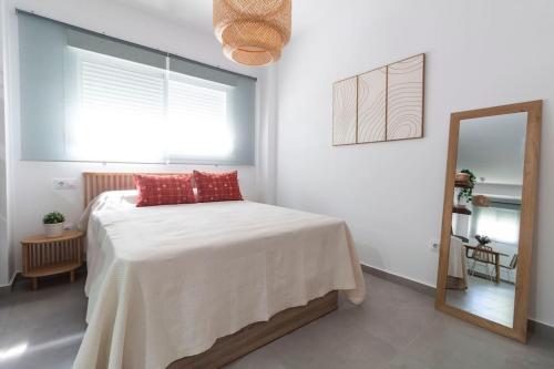 Llit o llits en una habitació de Tartessos Apartamentos 1